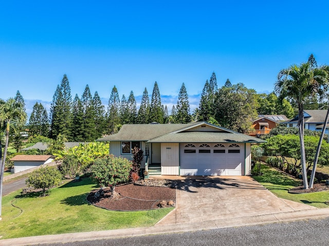 ranch-style home with a front yard and a garage