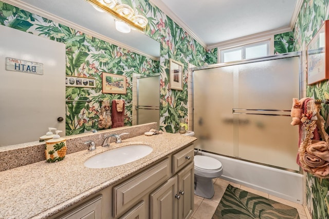 full bathroom with tile patterned floors, vanity, toilet, ornamental molding, and combined bath / shower with glass door