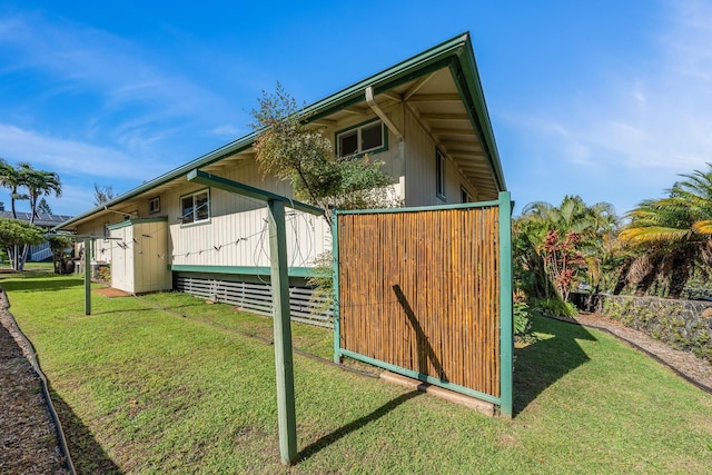 view of property exterior featuring a lawn