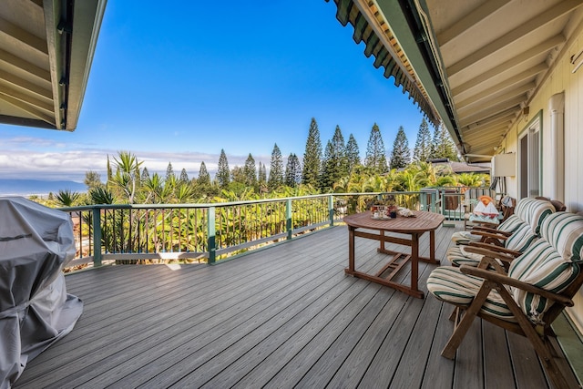 wooden terrace featuring grilling area