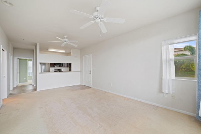 123 Hoowaiwai Loop Unit 1801, Wailuku, HI 96793 - unfurnished living room featuring light colored carpet, ceiling fan, and baseboards
