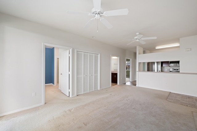 123 Hoowaiwai Loop Unit 1801, Wailuku, HI 96793 - unfurnished living room with carpet flooring, ceiling fan, and baseboards
