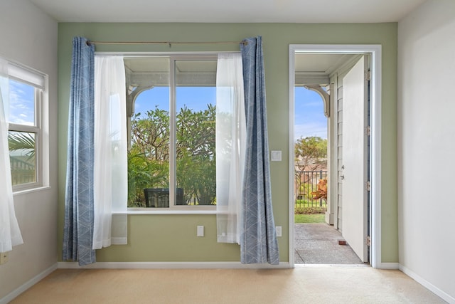 123 Hoowaiwai Loop Unit 1801, Wailuku, HI 96793 - doorway featuring carpet flooring, plenty of natural light, and baseboards