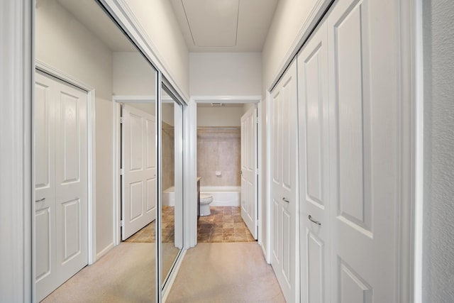 123 Hoowaiwai Loop Unit 1801, Wailuku, HI 96793 - hallway featuring light colored carpet and attic access