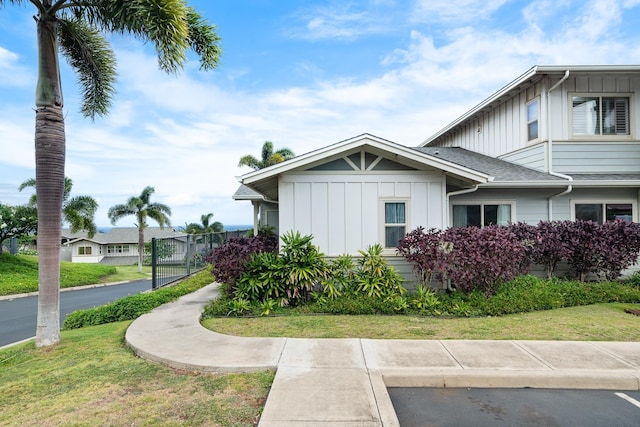 123 Hoowaiwai Loop Unit 1801, Wailuku, HI 96793 - view of side of home with board and batten siding and a yard