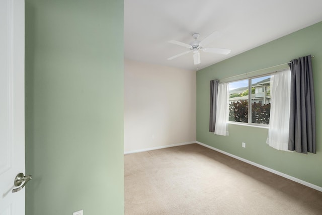 123 Hoowaiwai Loop Unit 1801, Wailuku, HI 96793 - spare room featuring light carpet, baseboards, and ceiling fan