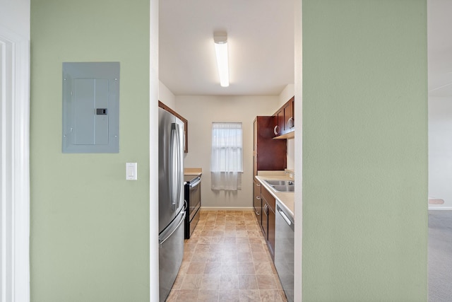 123 Hoowaiwai Loop Unit 1801, Wailuku, HI 96793 - kitchen featuring electric panel, stainless steel appliances, light countertops, baseboards, and a sink