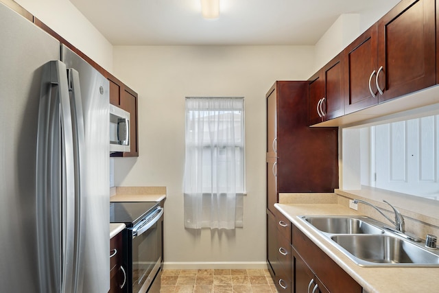 123 Hoowaiwai Loop Unit 1801, Wailuku, HI 96793 - kitchen with appliances with stainless steel finishes, a sink, baseboards, and light countertops