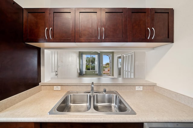 123 Hoowaiwai Loop Unit 1801, Wailuku, HI 96793 - kitchen featuring a sink, light countertops, dishwasher, and dark brown cabinetry