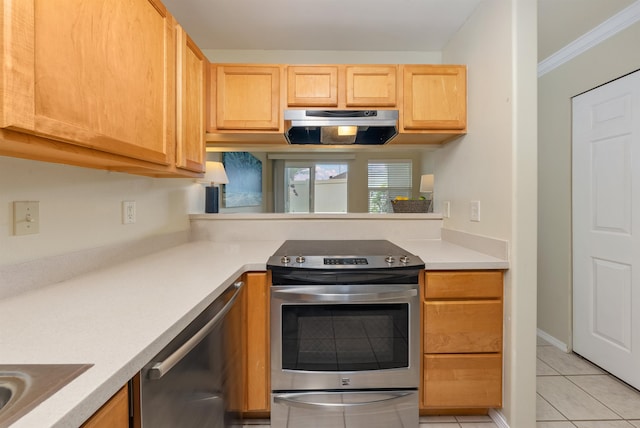 kitchen featuring stainless steel appliances, ornamental molding, and light tile floors