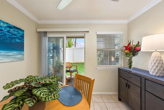 dining space with crown molding and light tile floors