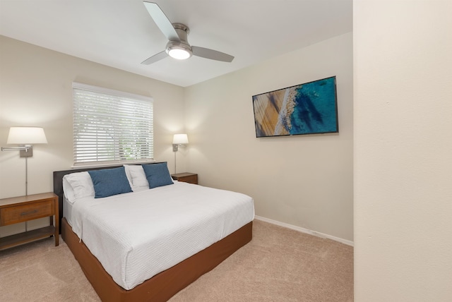 bedroom featuring ceiling fan and light colored carpet