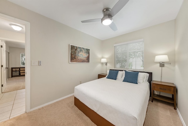 bedroom with ceiling fan and light tile floors