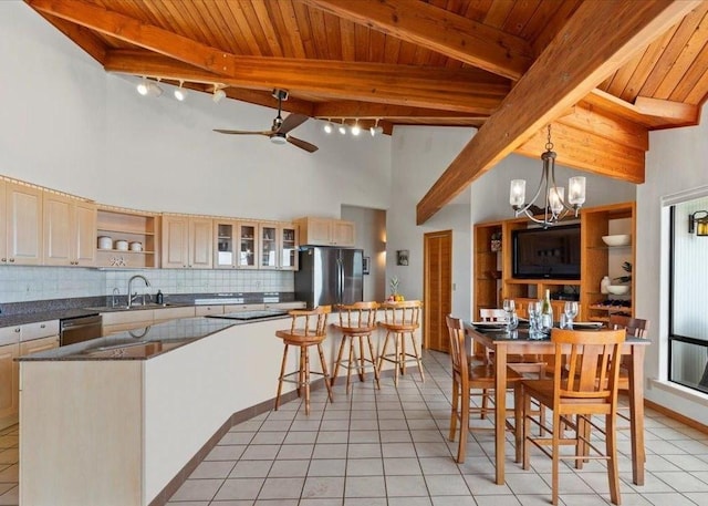 interior space with ceiling fan with notable chandelier, wooden ceiling, high vaulted ceiling, and beamed ceiling