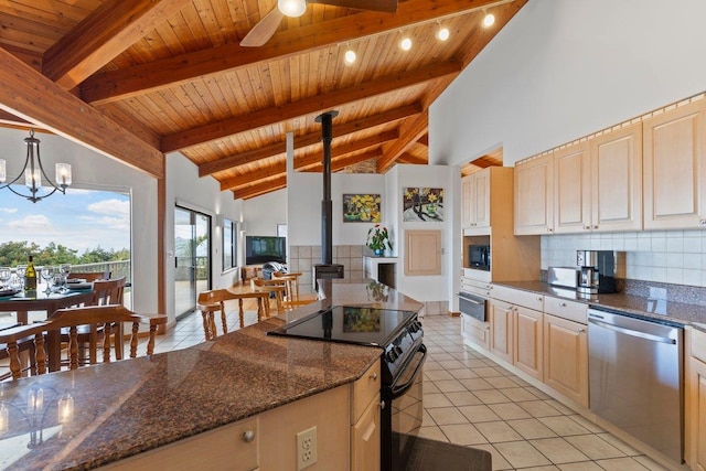 kitchen featuring wooden ceiling, decorative backsplash, a wood stove, high vaulted ceiling, and black appliances