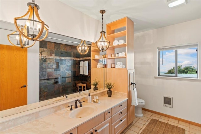 bathroom featuring tile patterned floors, vanity, an inviting chandelier, toilet, and heating unit