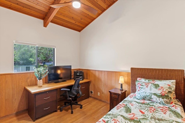 bedroom featuring light hardwood / wood-style floors, wooden ceiling, ceiling fan, and vaulted ceiling with beams