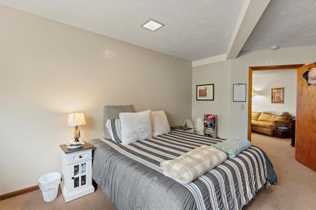 carpeted bedroom with a textured ceiling