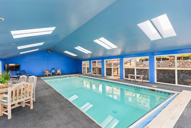 view of pool featuring a skylight