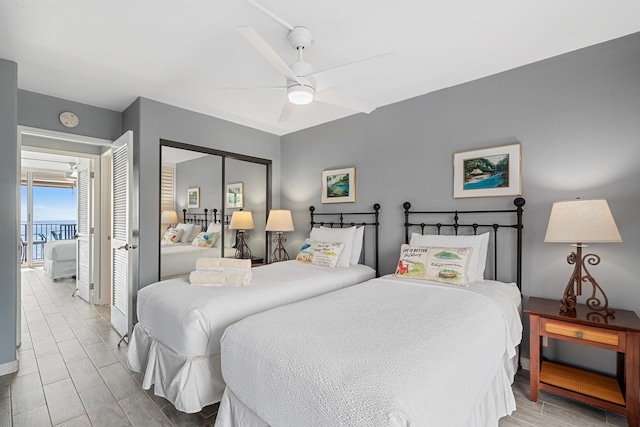 bedroom with a ceiling fan and a closet