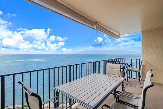 balcony featuring a water view