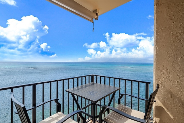 balcony featuring a water view