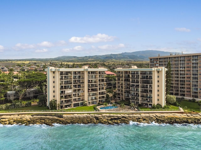 exterior space featuring a water and mountain view