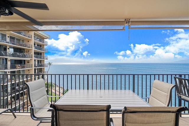 balcony featuring a water view