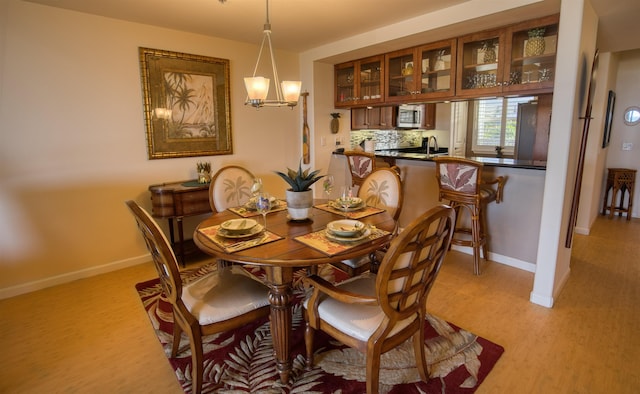 dining space with light wood-type flooring