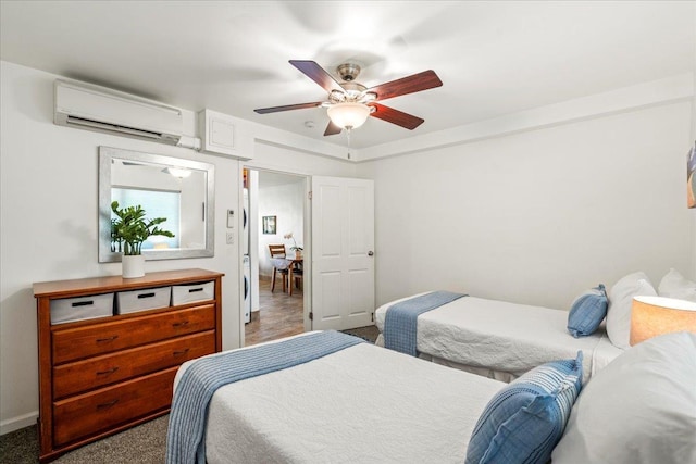 2387 S Kihei Rd Unit C108, Kihei, HI 96753 - bedroom featuring a wall mounted air conditioner, ceiling fan, and baseboards