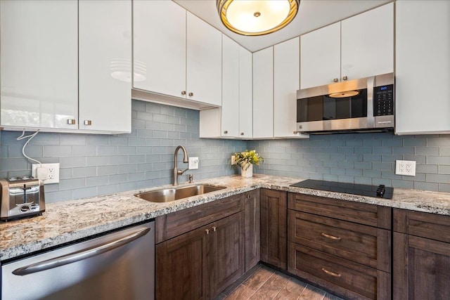 2387 S Kihei Rd Unit C108, Kihei, HI 96753 - kitchen with stainless steel appliances, a sink, white cabinets, and decorative backsplash