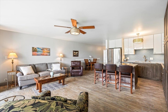 2387 S Kihei Rd Unit C108, Kihei, HI 96753 - living area featuring ceiling fan and light wood finished floors