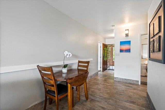 2387 S Kihei Rd Unit C108, Kihei, HI 96753 - dining room with dark wood-type flooring and baseboards