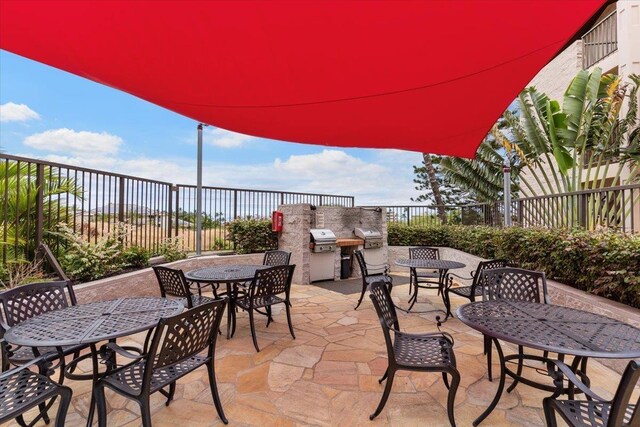 2387 S Kihei Rd Unit C108, Kihei, HI 96753 - fenced backyard with outdoor dining space and a patio area