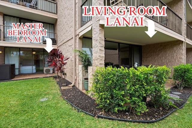 2387 S Kihei Rd Unit C108, Kihei, HI 96753 - doorway to property with cooling unit and a lawn