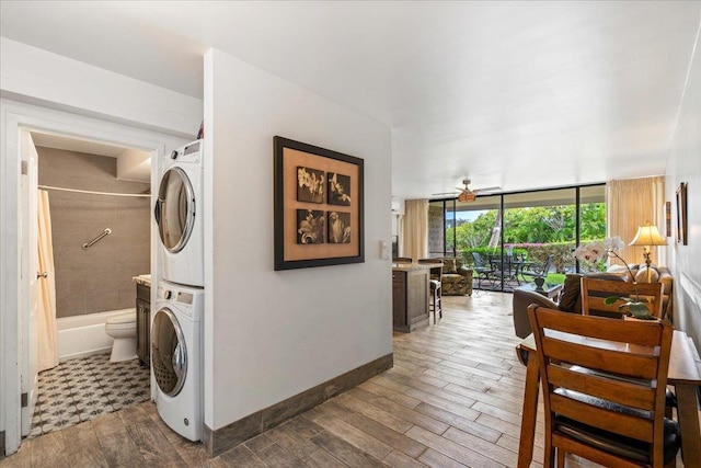 2387 S Kihei Rd Unit C108, Kihei, HI 96753 - washroom with estacked washer and dryer and wood finished floors