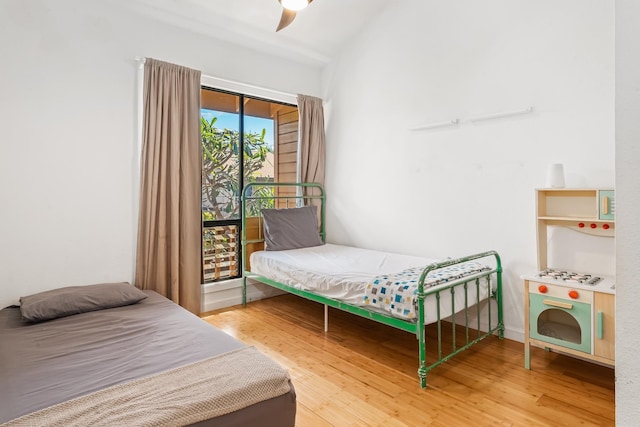 15 Kulanihakoi St Unit 3E, Kihei, HI 96753 - bedroom with wood finished floors, lofted ceiling, and ceiling fan