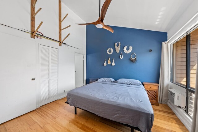 15 Kulanihakoi St Unit 3E, Kihei, HI 96753 - bedroom featuring a closet, light wood-style flooring, a ceiling fan, and high vaulted ceiling