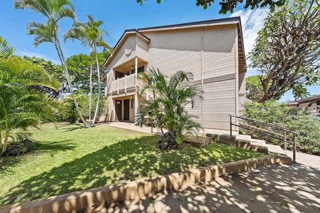 15 Kulanihakoi St Unit 3E, Kihei, HI 96753 - view of front of home featuring a patio area, a front yard, and a balcony