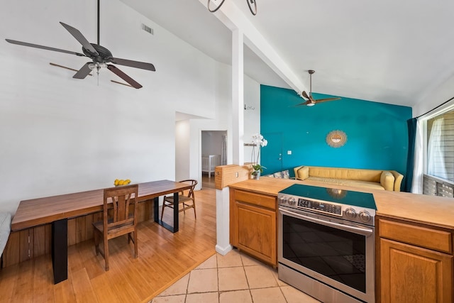 15 Kulanihakoi St Unit 3E, Kihei, HI 96753 - kitchen featuring light countertops, stainless steel electric stove, a ceiling fan, and visible vents