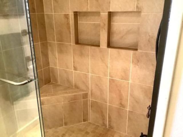 bathroom featuring walk in shower