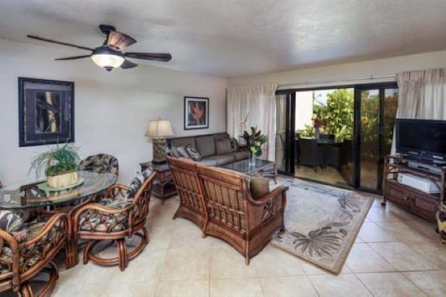 living room featuring light tile patterned flooring and ceiling fan