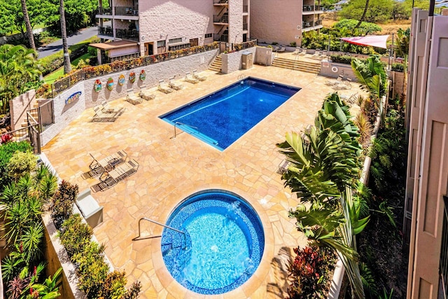 view of swimming pool with a patio