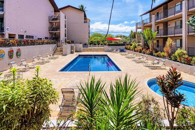 view of pool featuring a patio