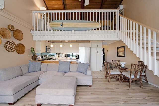 living room featuring a wall unit AC, wooden ceiling, and light wood-type flooring