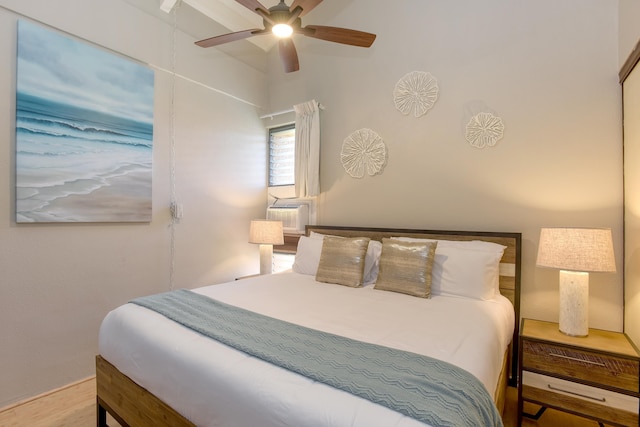 bedroom featuring ceiling fan, cooling unit, and wood-type flooring