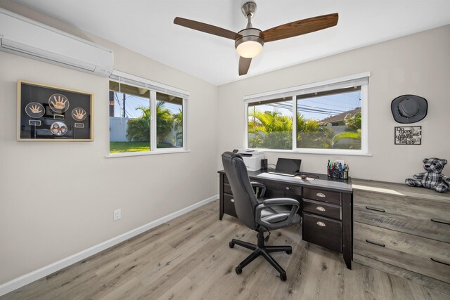 155 Aliilani Pl, Kihei, HI 96753 - home office featuring a wall mounted AC, light wood-style flooring, baseboards, and plenty of natural light