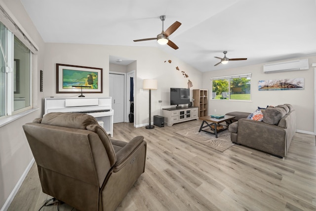 155 Aliilani Pl, Kihei, HI 96753 - living room with a wall mounted AC, ceiling fan, light wood finished floors, lofted ceiling, and baseboards