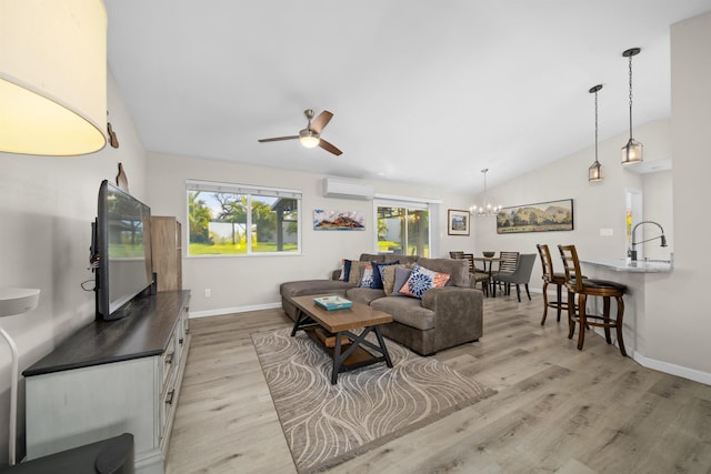 155 Aliilani Pl, Kihei, HI 96753 - living area featuring a wall mounted AC, vaulted ceiling, light wood-style flooring, ceiling fan, and baseboards
