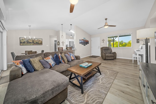 155 Aliilani Pl, Kihei, HI 96753 - living area with ceiling fan, vaulted ceiling, light wood finished floors, a chandelier, and baseboards